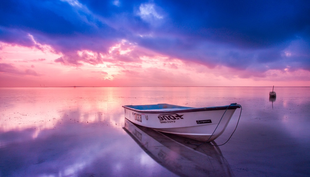 aluminum boat at sunset