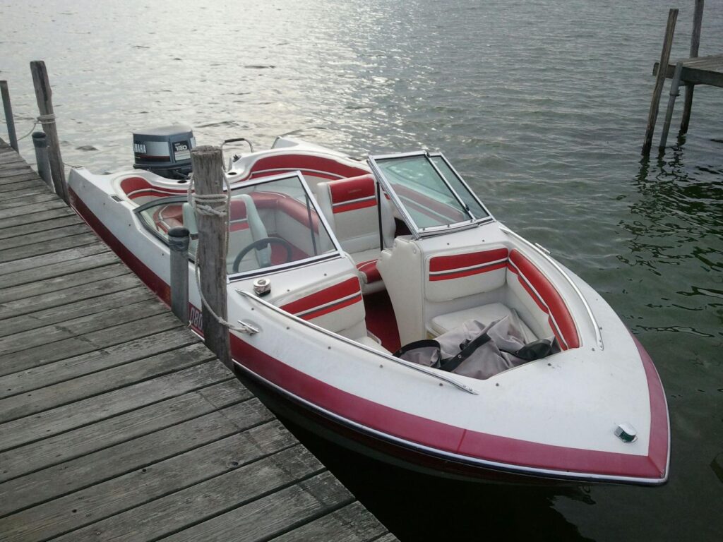 Red Forester outboard bow rider
